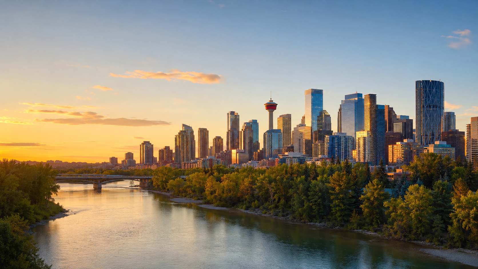 Calgary skyline at golden hour with the Calgary Tower, Bow River and downtown high-rises in Alberta, Canada.